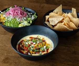 chorizo corn, chips and a salad