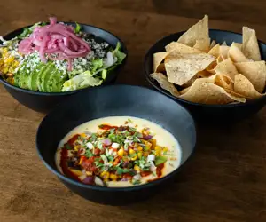 chorizo corn, chips and a salad